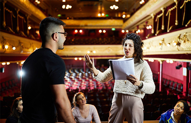 people talking in theatre