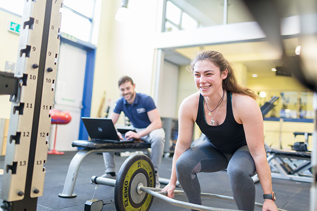 LJMU girl lifting weights